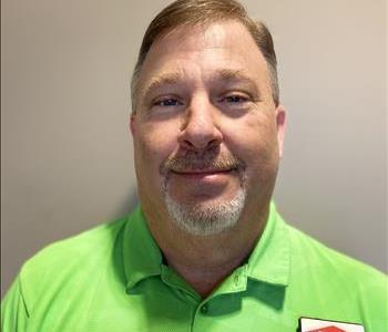 Wade in a SERVPRO green Nike polo shirt with his SERVPRO name tag.