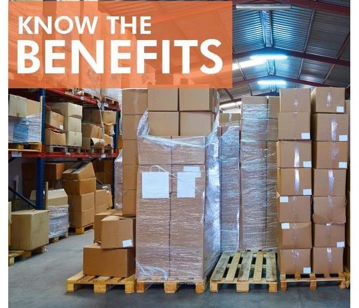 Boxes stacked on a pallet with shrink wrap titled Know The Benefits.