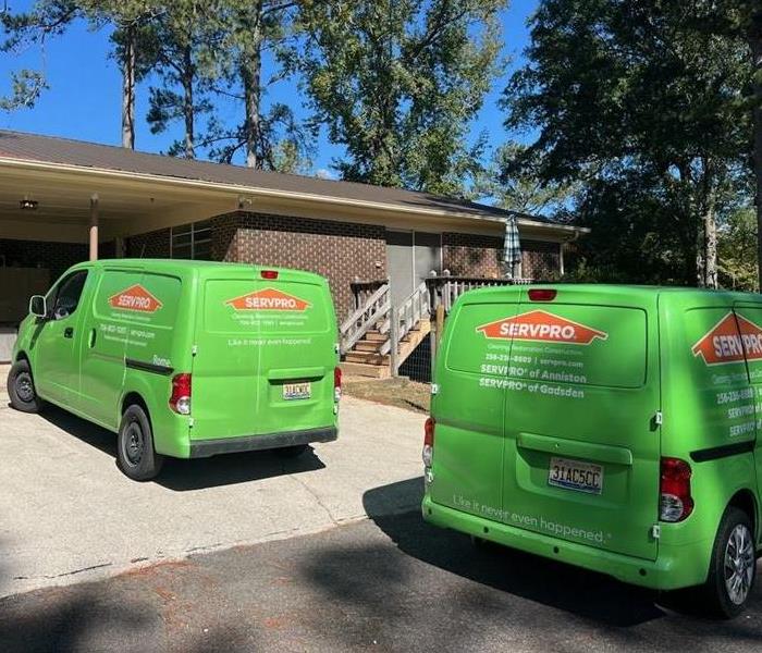 Servpro vehicles in front of house 